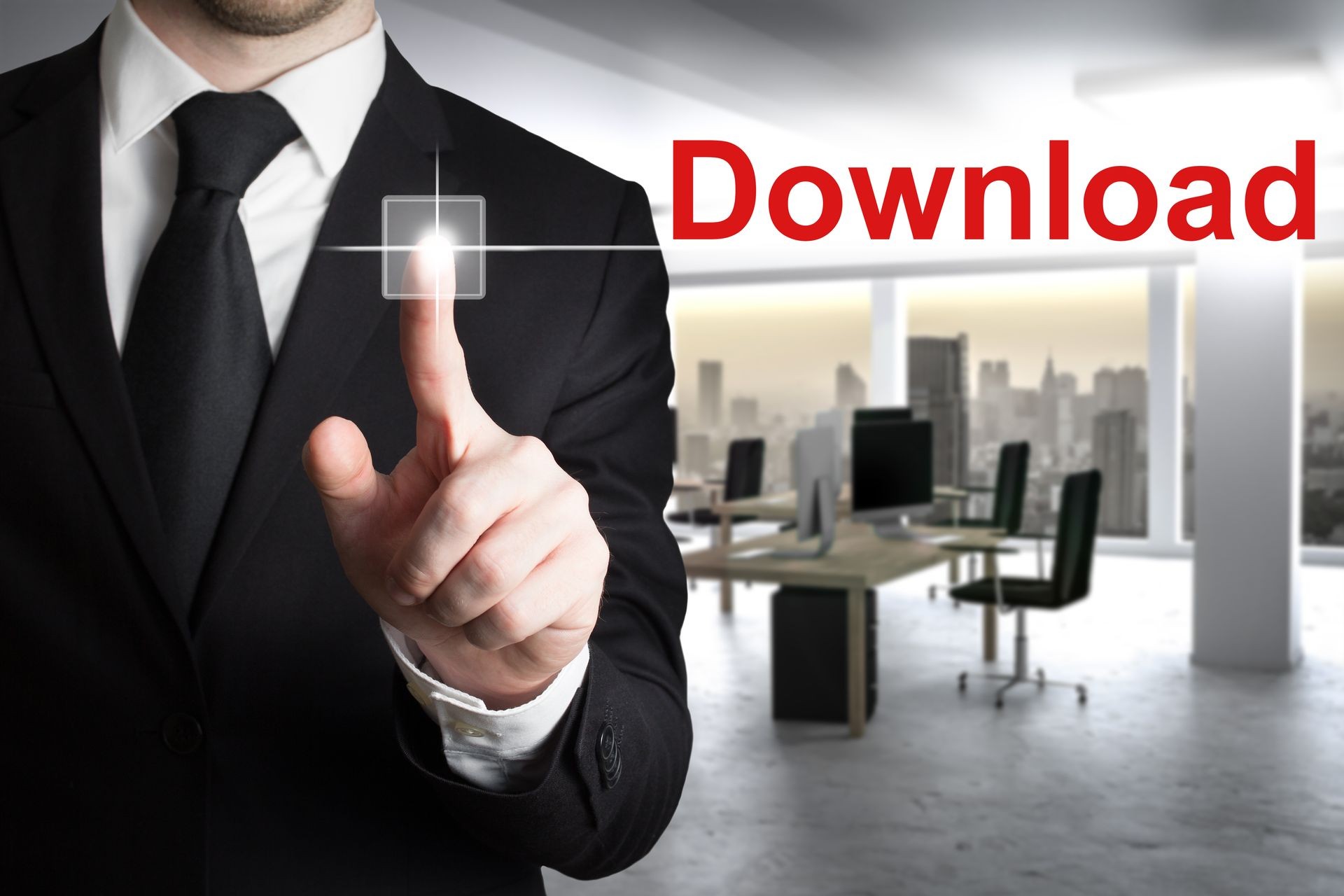 businessman in modern office pushing button download